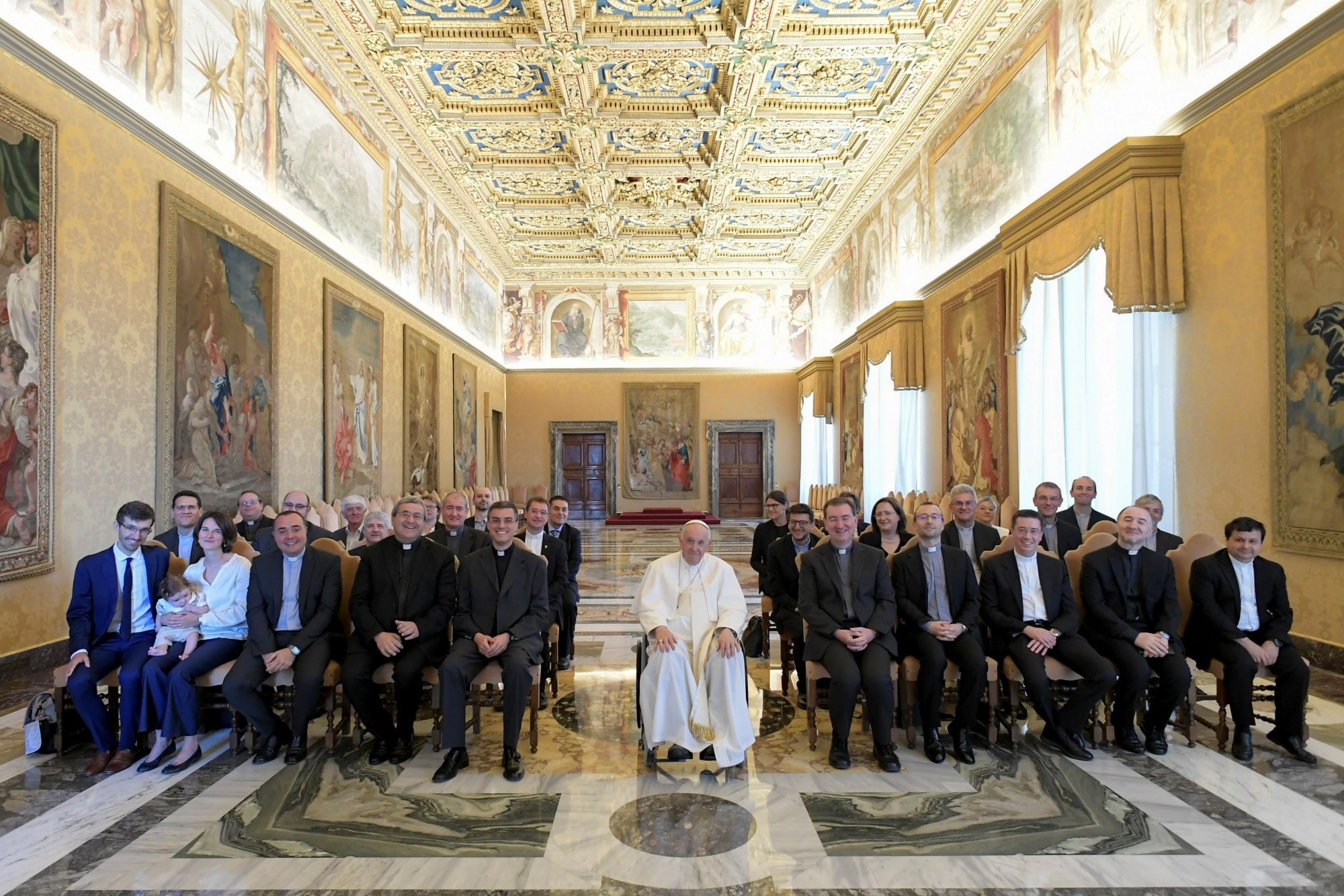 Pope Francis poses with the rector and members of the staff of the Milan archdiocesan seminary