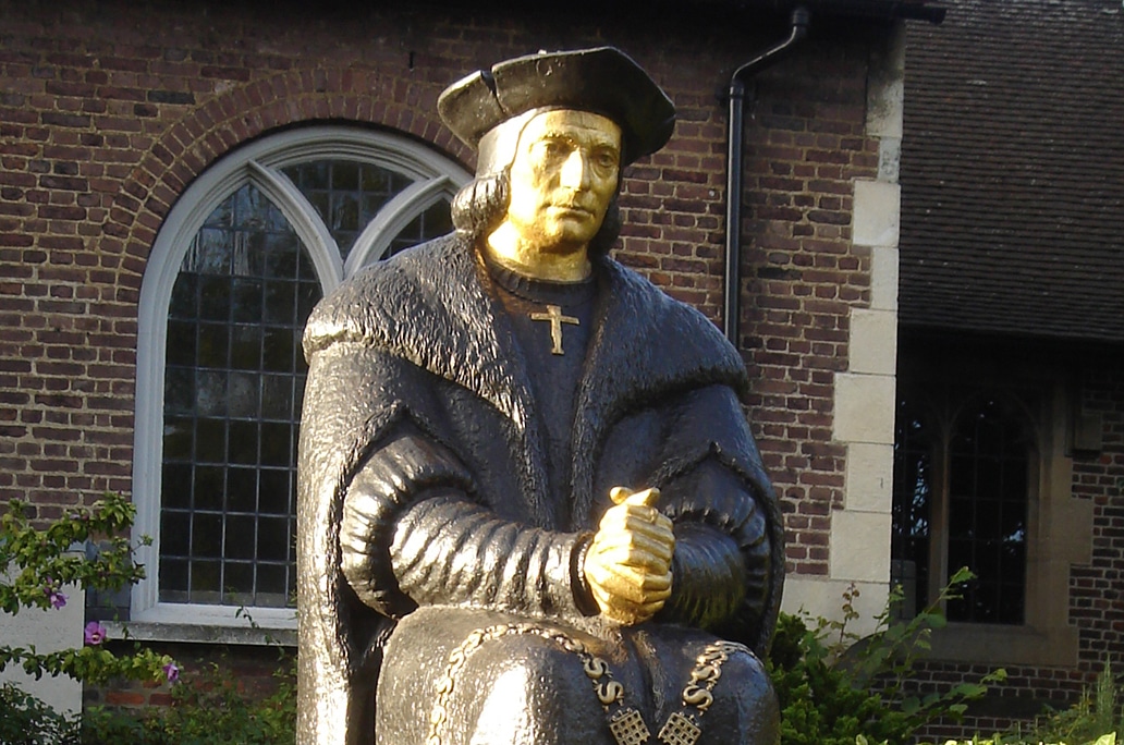 A colorful outdoor statue of St. Thomas More.